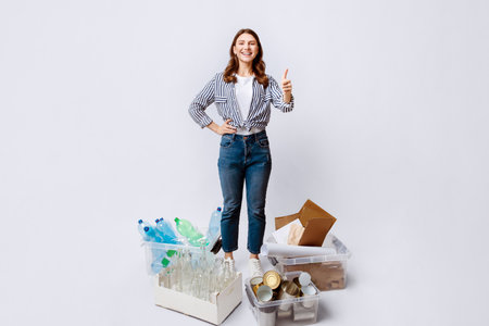 Sustainability Concept. Woman Standing Next To Containers With Different Materials For Recycling