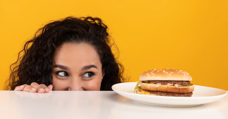 Hungry Lady Looking At Burger Peeping Out Table