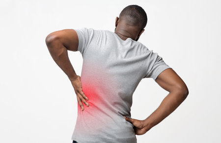 Black man holding his hand behind his back
