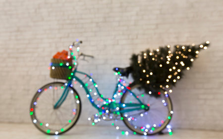 Blurred flickering bicycle with pine tree on beige backgroundの写真素材