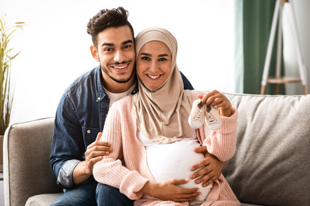 Portrait Of Happy Loving Islamic Family Awaiting For A Babyの写真素材