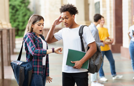 Hurry up! Multiracial students in university campusの写真素材