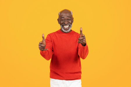 Happy senior african american man coach point finger at camera, motivatedの写真素材