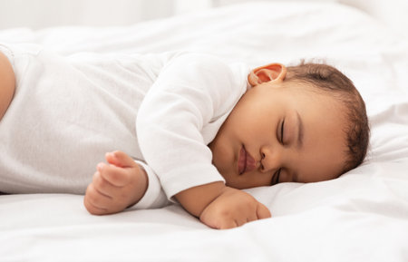 Cute Baby Toddler Sleeping Peacefully Lying In Bed At Homeの写真素材