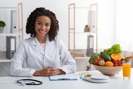 Attractive female nutritionist posing at her modern officeの写真素材