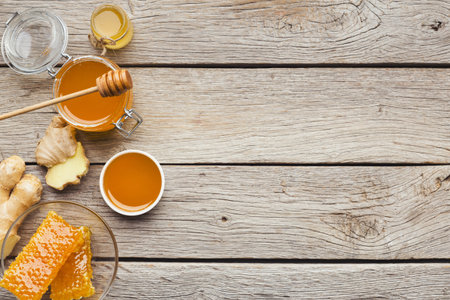 Various types of honey on wooden background, top viewの写真素材
