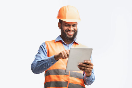Architect Using Digital Tablet Working On Construction Site, White Backgroundの写真素材