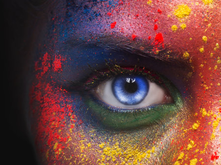 Blue eye of woman looking at camera on blackの写真素材