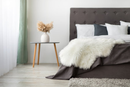 Modern comfortable minimal chic bedroom in boho and scandinavian styleの写真素材