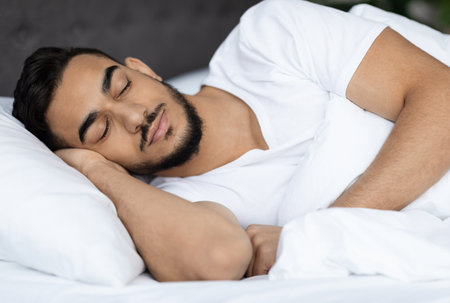 Portrait Of Young Handsome Middle Eastern Guy Sleeping In Bed At Home