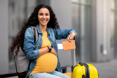 Happy young pregnant woman travelling alone, copy spaceの写真素材