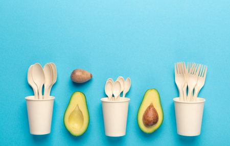 Avocado seeds recycling into disposable tableware on blue