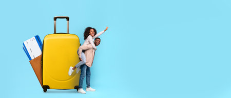 Excited travelers preparing for summer vacation with colorful suitcaseの写真素材