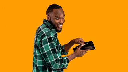 Sneaky African Man Holding Wallet With Money Over Yellow Background