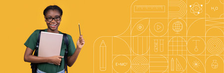 Student studying with books and tools against a bright backgroundの写真素材