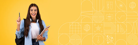 Smiling student holding books and pen in a bright yellow study space