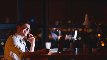 Entrepreneur Talking On Cellphone Sitting In Modern Office, Panoramaの写真素材