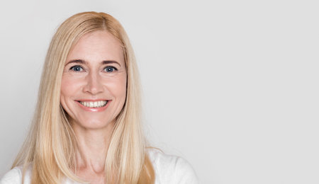 Beautiful middle aged woman smiling at cameraの写真素材