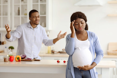 African american guy shouting at his pregnant wifeの写真素材