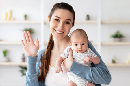 Beautiful Young Mom Holding Newborn Baby And Making Video Call, POV Screenshotの写真素材