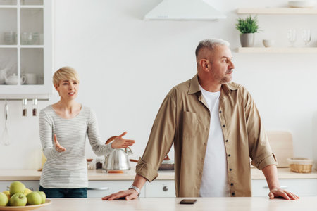 Quarrel at home, screams, angry couple, family problems and scandal during covid-19 lockdownの写真素材