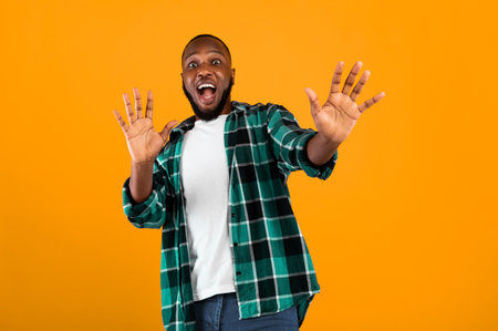 Shocked Black Guy Shouting Gesturing Stop Standing Over Yellow Backgroundの写真素材