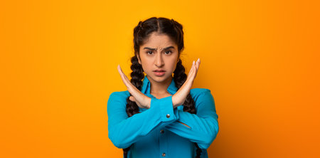 Angry indian woman crossing arms showing stop gesture