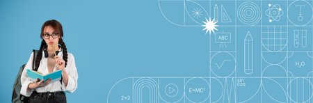 Student engaged in studying with painted background and ample copy spaceの写真素材