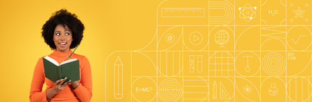 Student studying with enthusiasm in a vibrant yellow settingの写真素材