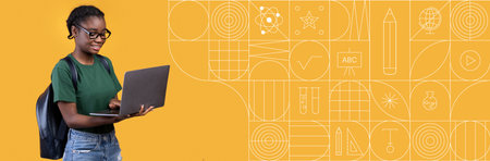 Student studying with laptop and painted background in bright colorsの写真素材