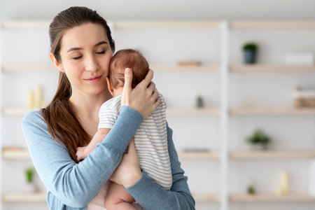 Being A Mother. Portrait Of Loving Young Woman Tenderly Embracing Newborn Baby
