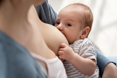 Closeup Shot Of Adorable Little Newborn Baby Suckling Milk From Mothers Breast
