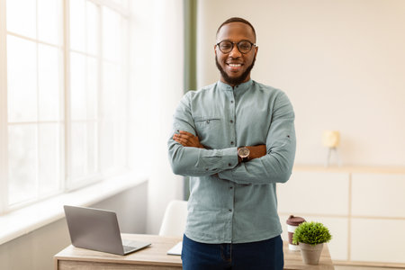 Successful African American Businessman Posing Standing In Modern Officeの写真素材