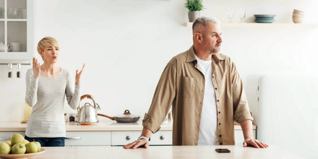 Difficulties and problems in relationships, scandal in kitchen during covid-19 lockdown at homeの写真素材