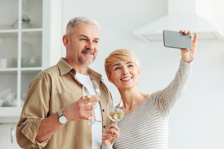 Happy romantic couple enjoying date and making selfie or online callの写真素材