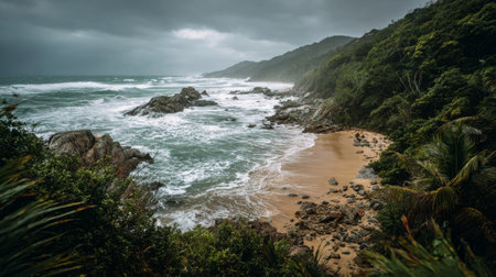 Stormy weather brings dramatic waves and dark clouds to a tranquil beach settingの素材