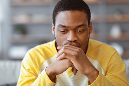 Pensive african american man thinking about something