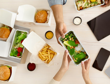 Modern gadgets at work in office or home, vegan meal takeaway duの写真素材