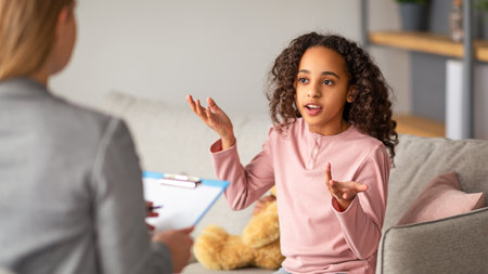 Successful therapy. Teen patient talking to psychologist at her office, expressing emotionsの写真素材