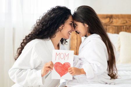 Happy mom and little daughter celebrating Mothers Day togetherの写真素材