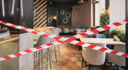 Hazard safety stripes across empty closed restaurantの写真素材
