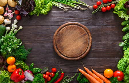 Frame of fresh vegetables on wooden background with copy spaceの写真素材