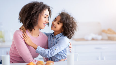Cute Little Afro Girl And Woman Hugging In Kitchen