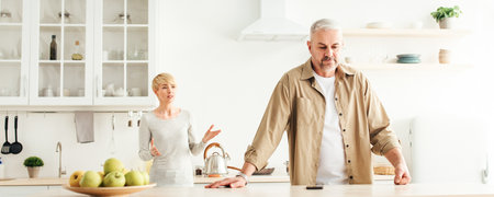 Angry annoyed wife blames husband, marriage problems at home. Covid-19 pandemic and bad relationshipsの写真素材