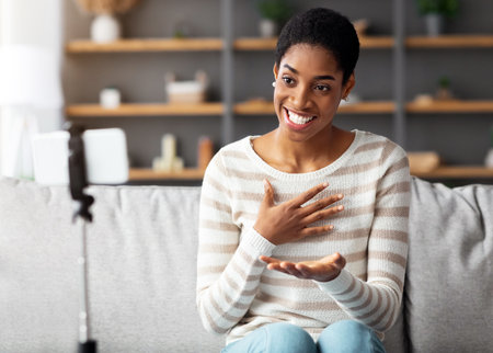 Video Blogging. Young Black Female Capturing Content For Vlog At Homeの写真素材