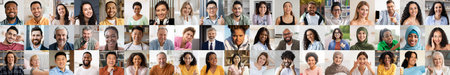 Diverse group of happy faces showcasing multiethnic unity and joyの写真素材