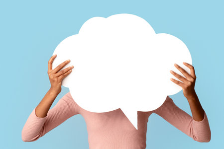 Black Woman Holding Blank Empty Speech Bubble In Front Of Her Face