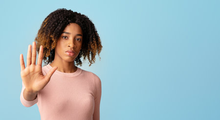 No Discrimination. Portrait Of Serious Black Woman Showing Stop Gesture At Cameraの写真素材
