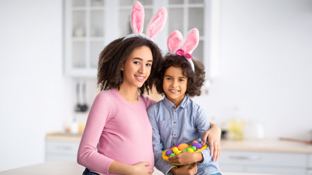 Black girl and pregnant lady wearing bunny ears on Easter
