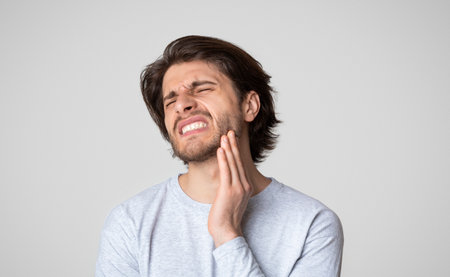 Man feeling pain in jaw. Dental health and care